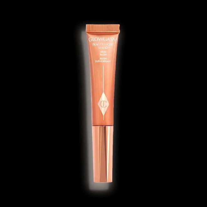 رژگونه هایلایتر مایع شارلوت تیلبری BEAUTY LIGHT WAND PEACHGASM A glowing, peach liquid high-blusher