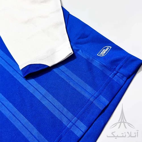 بلوز آستین دار ورزشی پسرانه فوتبالی برند آمبرو Umbro اورجینال وارداتی آبی سفید — تصویر ۴