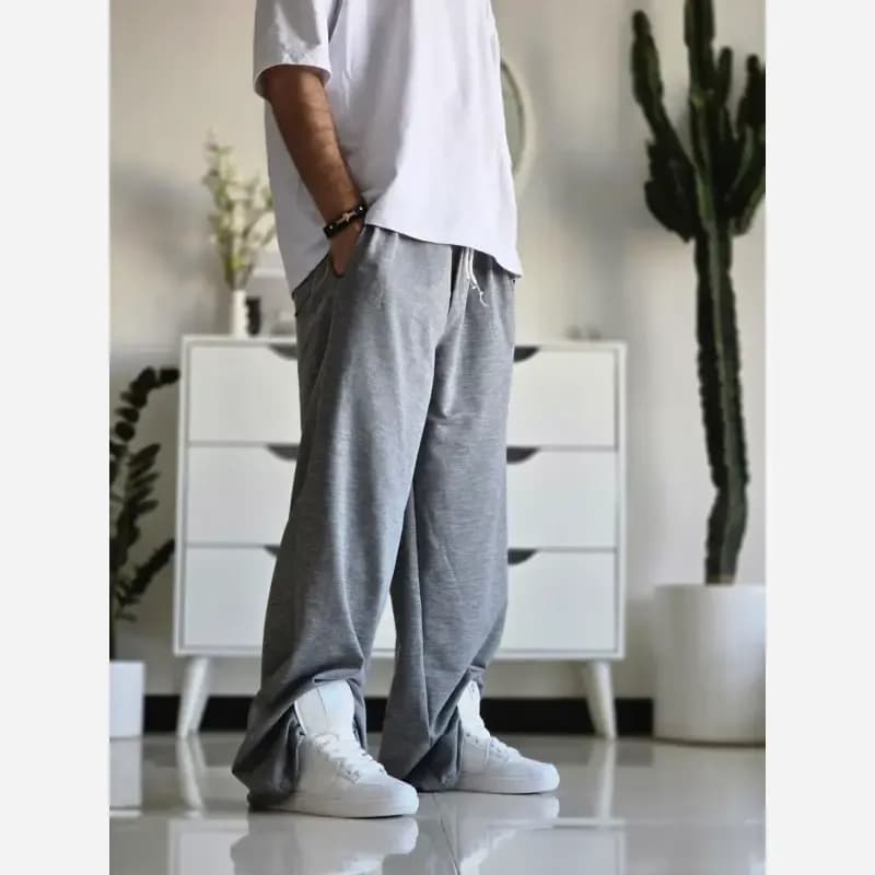 شلوار اسلش فول بگ مشکی طوسی برفی سایز XXL XXXL مناسب آقایان و خانم ها قد 115 — تصویر ۳
