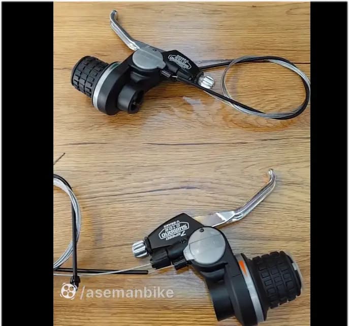 خرید دسته دنده SB-C101 دوچرخه شیمانو 3در 7 21 سرعته / دسته دنده و ترمز یکپارچه قابلیت نصب کیلومتر شمار شیمانو / اصل با ضمانت ©️ کمترین قیمت عمده بازار / دوچرخه چند منظوره شهری کوهستان / SHIFT LEV — تصویر ۲