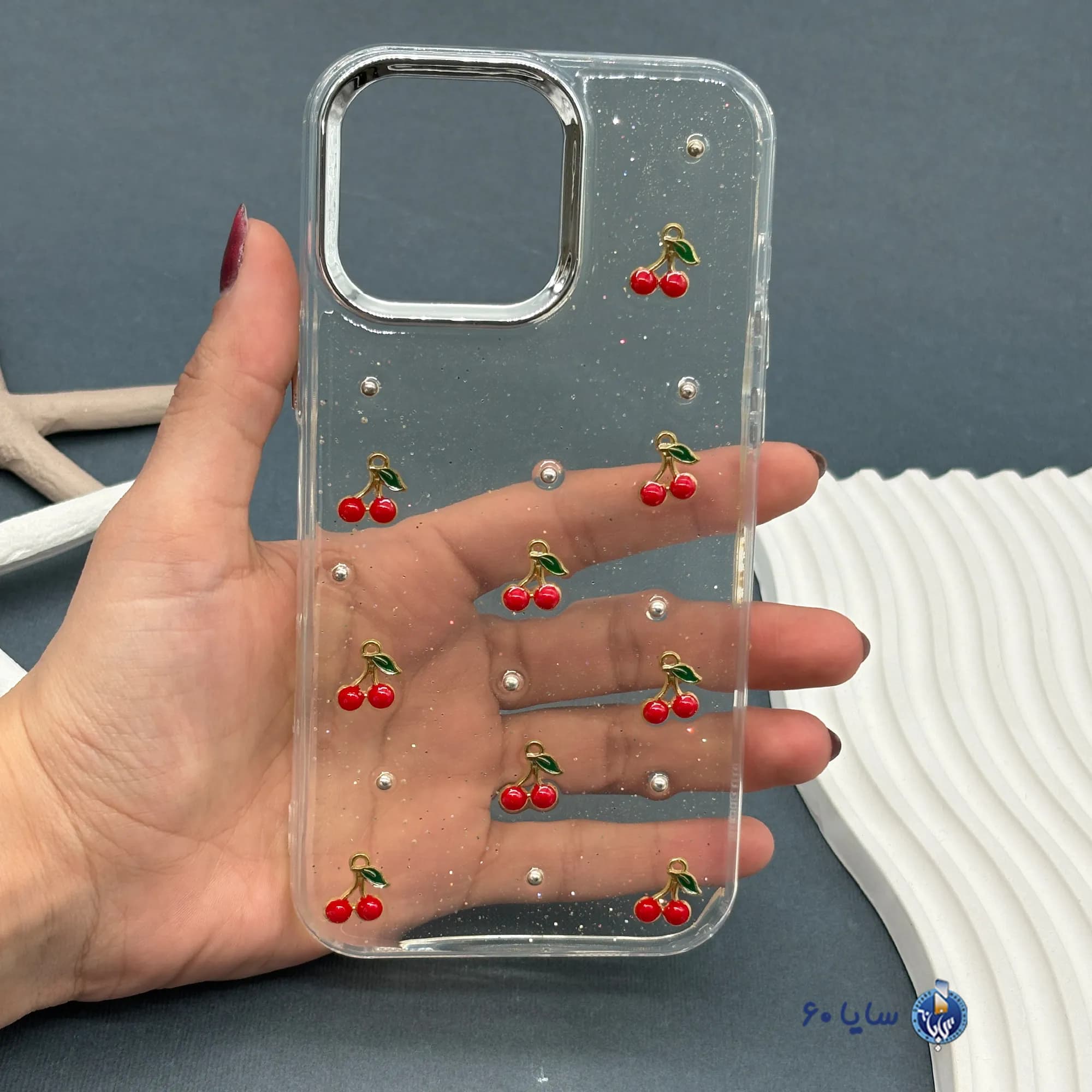 قاب موبایل IPHONE 16 PROMAX رزینی اکلیلی طلایی مدل آلبالو