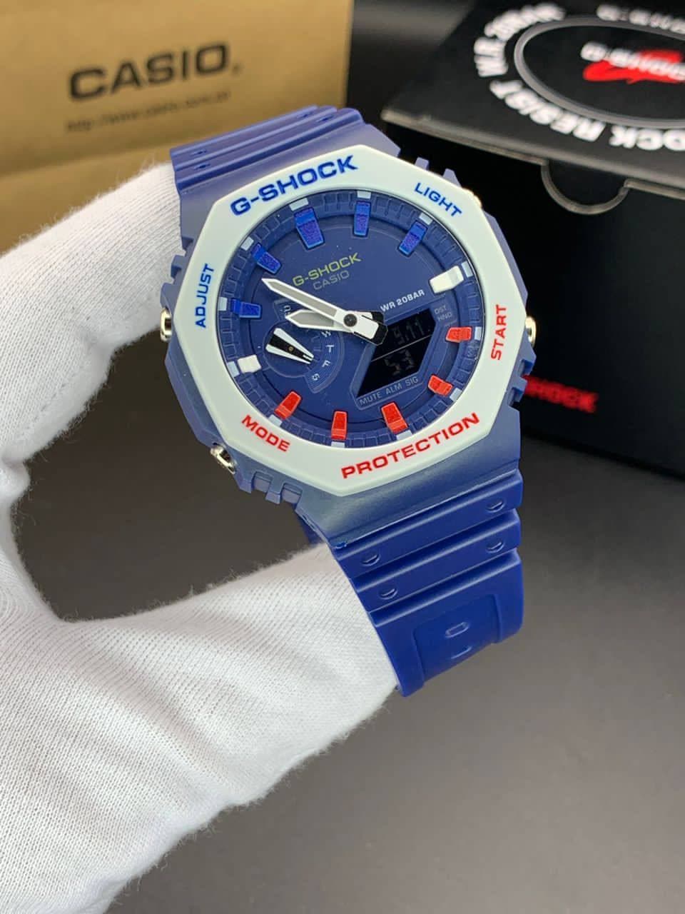 ساعت مچی کاسیو جیشاک مدل GA-2100 صفحه آبی دور سفید بند آبی