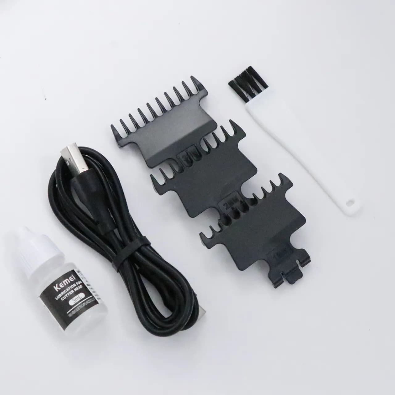 ماشین خط زن شارژی کمی Kemei Professional Hair Clipper 2299 — تصویر ۷