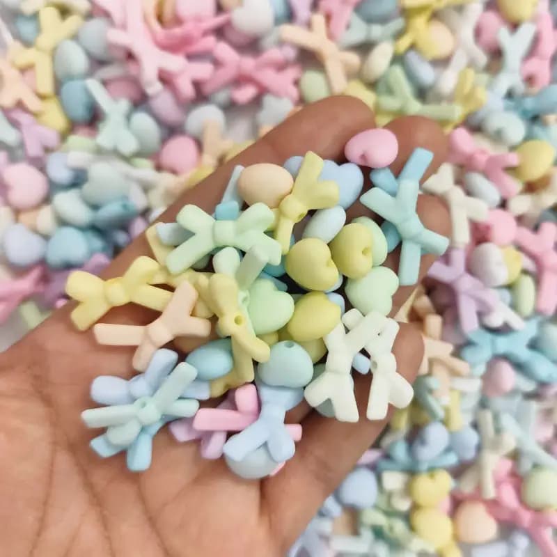 مهره رنگی طرح مخملی متنوع قلب و پاپیون(100گرم) — تصویر ۴