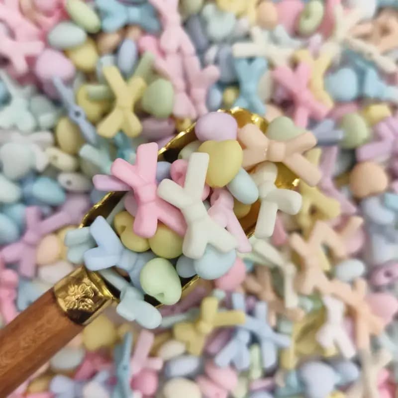 مهره رنگی طرح مخملی متنوع قلب و پاپیون(100گرم)