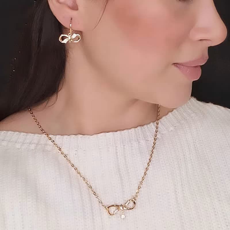 نیم ست گوشواره و گردنبند دخترانه پاپیون رنگ طلاییHGH
