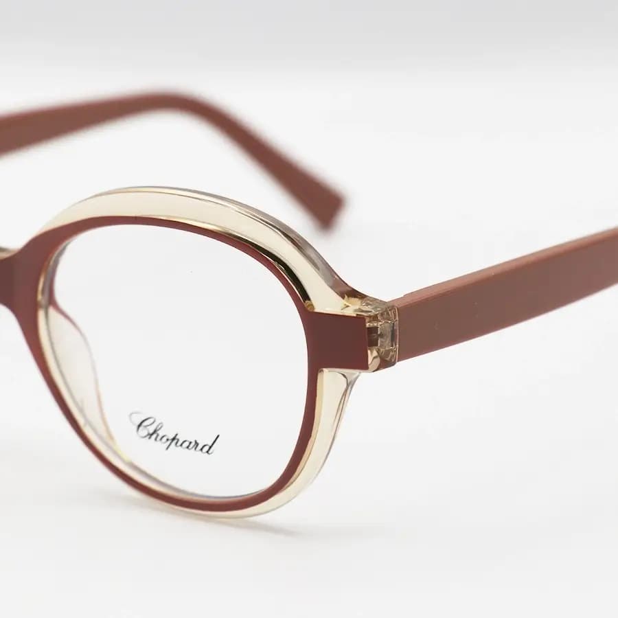 عینک طبی زنانه Chopard با فریم رنگ عسلی و صورتی براق، شکل گرد، دسته سیم‌دار و لولا فنردار مدل 2216 — تصویر ۵