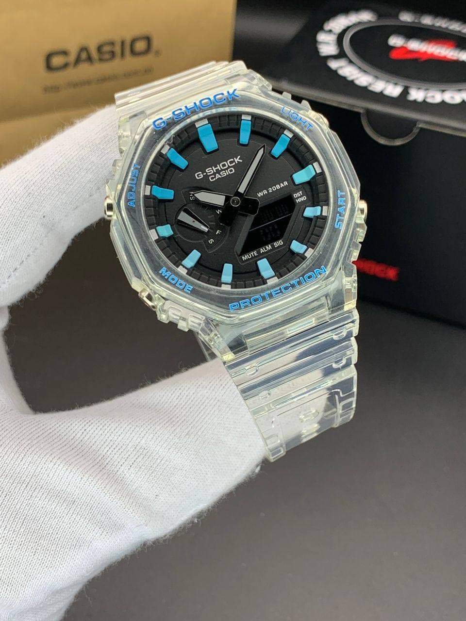 ساعت مچی کاسیو جیشاک مدل GA-2100 صفحه مشکی آبی بند شفاف