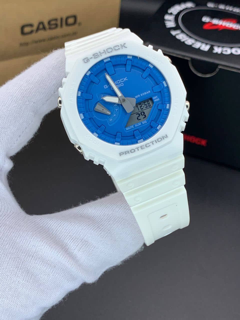 ساعت مچی کاسیو جیشاک مدل GA-2100 صفحه آبی دور سفید بند سفید