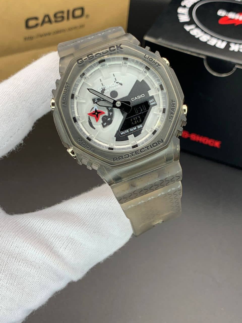 ساعت مچی کاسیو جیشاک مدل GA-2100 صفحه سفید طرحدار بند خاکی