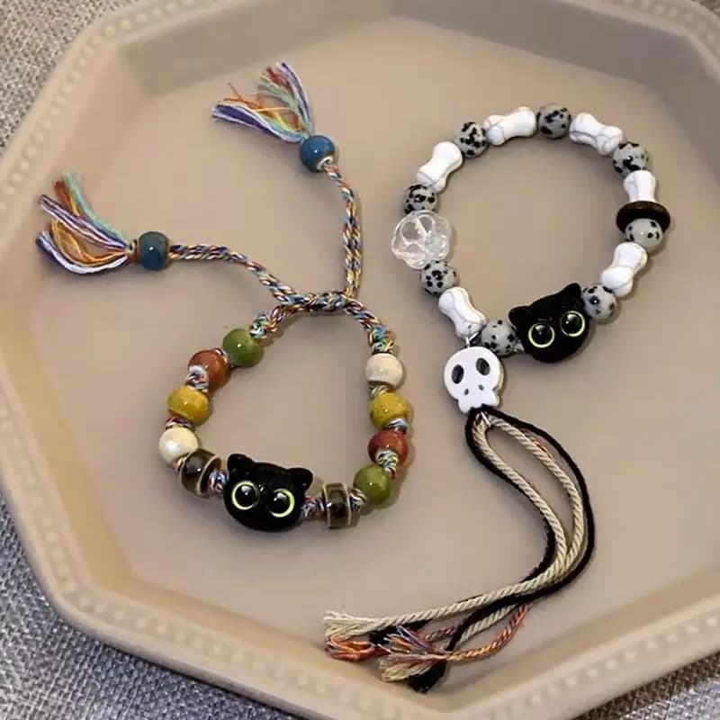 ست دستبند بافتنی زنانه و مردانه طرح اسکلت و گربه ۲ عددی — تصویر ۲