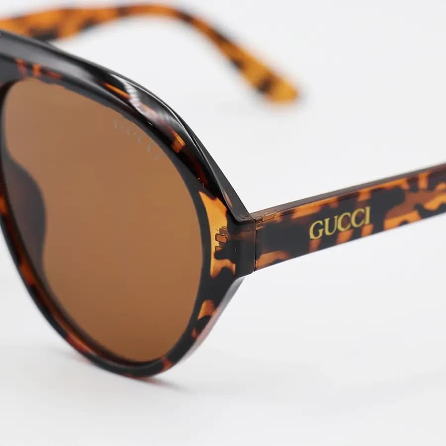 عینک آفتابی ترند Gucci با فریم هاوانا (پلنگی) براق، شکل خلبانی، دسته سیم‌دار و لنز قهوه‌ای تیره مدل 62605 — تصویر ۶