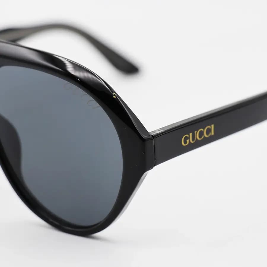 عینک آفتابی ترند Gucci با فریم مشکی براق، شکل خلبانی، دسته سیم‌دار و لنز دودی تیره مدل 62605 — تصویر ۶
