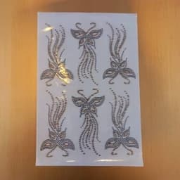 نگین حرارتی طرح پروانه دنباله دار ( ترکیب طلایی مشکی) . چادر . نگین چادر . مانتو . نگین چسبی — تصویر ۳