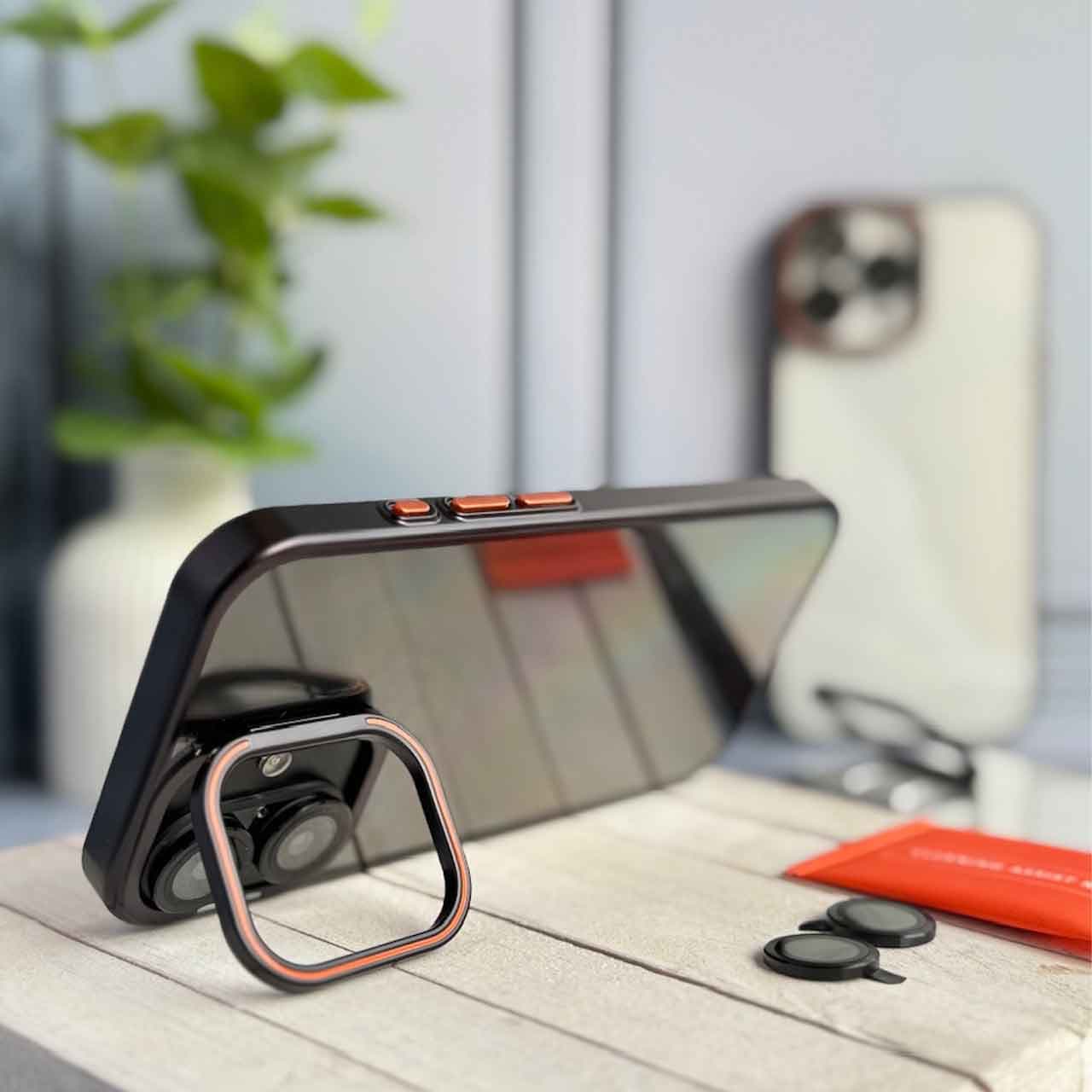 قاب orange lens استند شو با محافظ لنز برای گوشی های آیفون — تصویر ۲