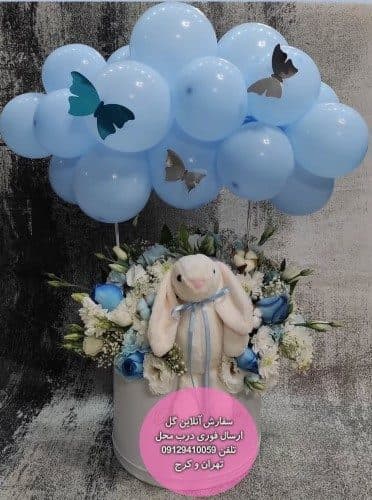 سبد گل رمانتیک گل و عروسک برای تبریک تولد نوزاد