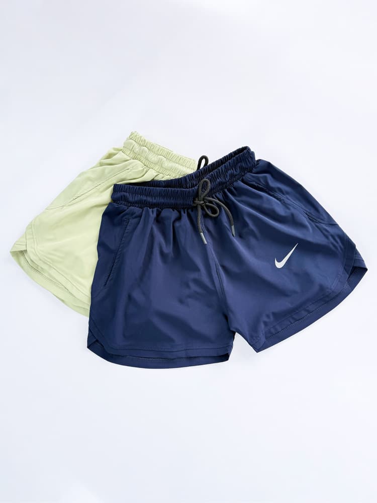 شورتک ورزشی زنانه بغل هلال جیب دار نایکی Nike — تصویر ۲