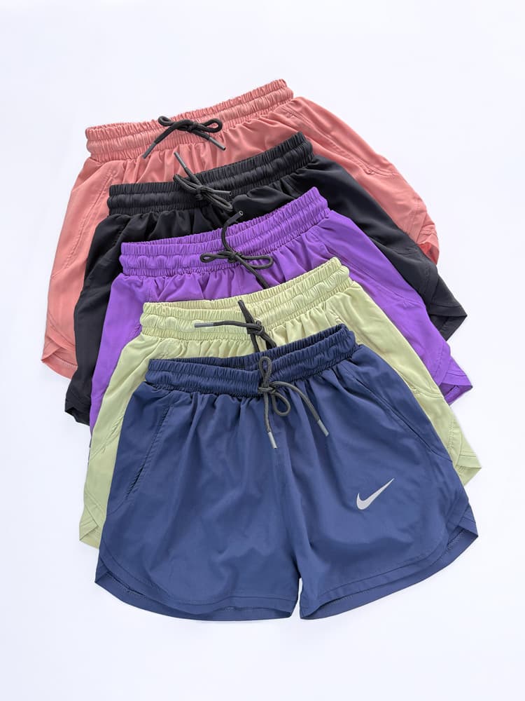 شورتک ورزشی زنانه بغل هلال جیب دار نایکی Nike — تصویر ۵