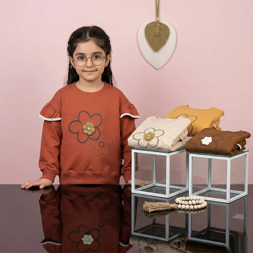 بلوز دخترانه طرح گل بالکدار رنگ نسکافه ای جنس پنبه