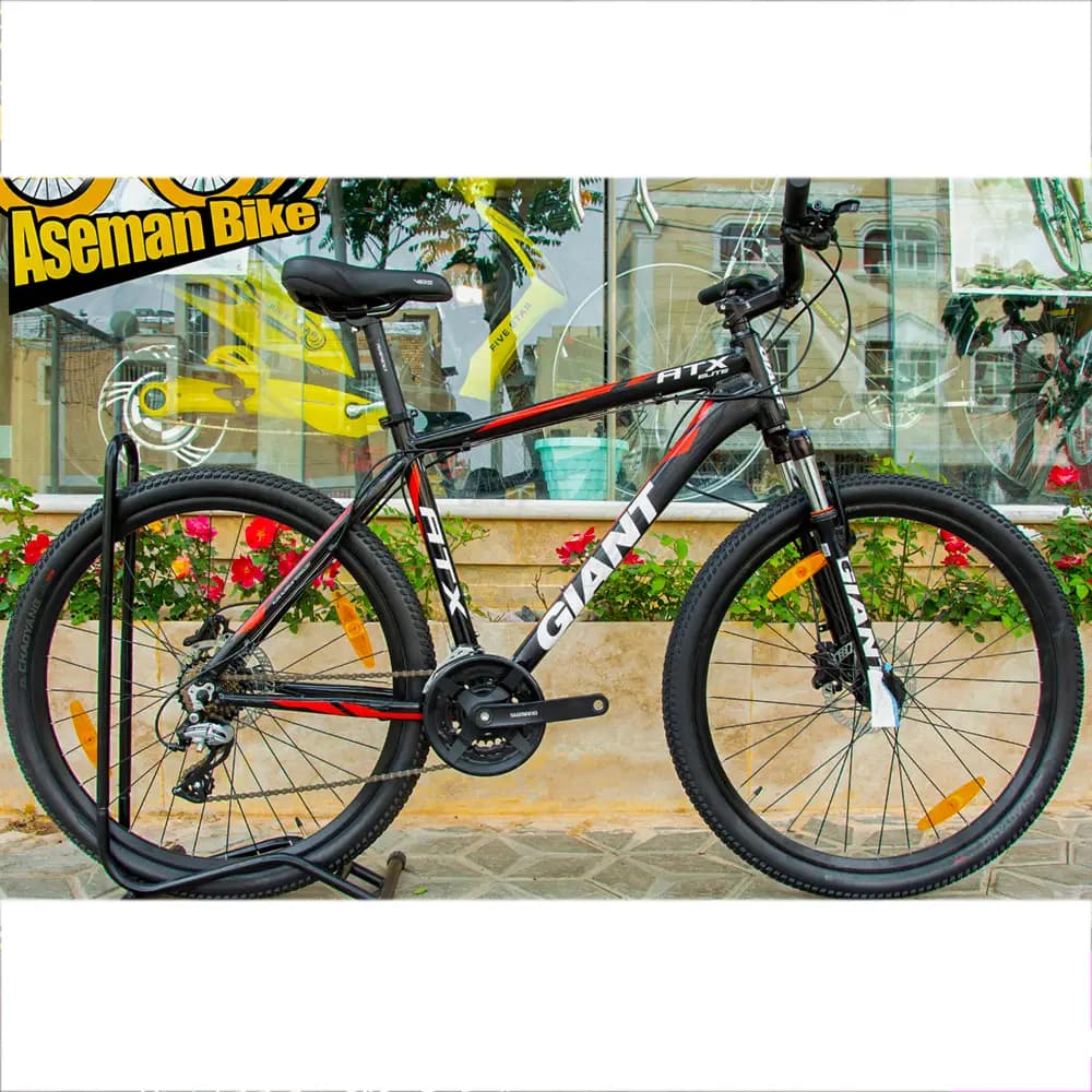 خرید دوچرخه 27.5 GIANT ATX Elite 1 کوهستان آلومینیوم جاینت ای تی ایکس الیت سایز 27.5 اینچ / ترمز روغن هیدرولیک / 24 (3×8) سرعته SHIMANO ACERA M360 / اصل با گارانتی ©️ کمترین قیمت عمده بازار / دوچ