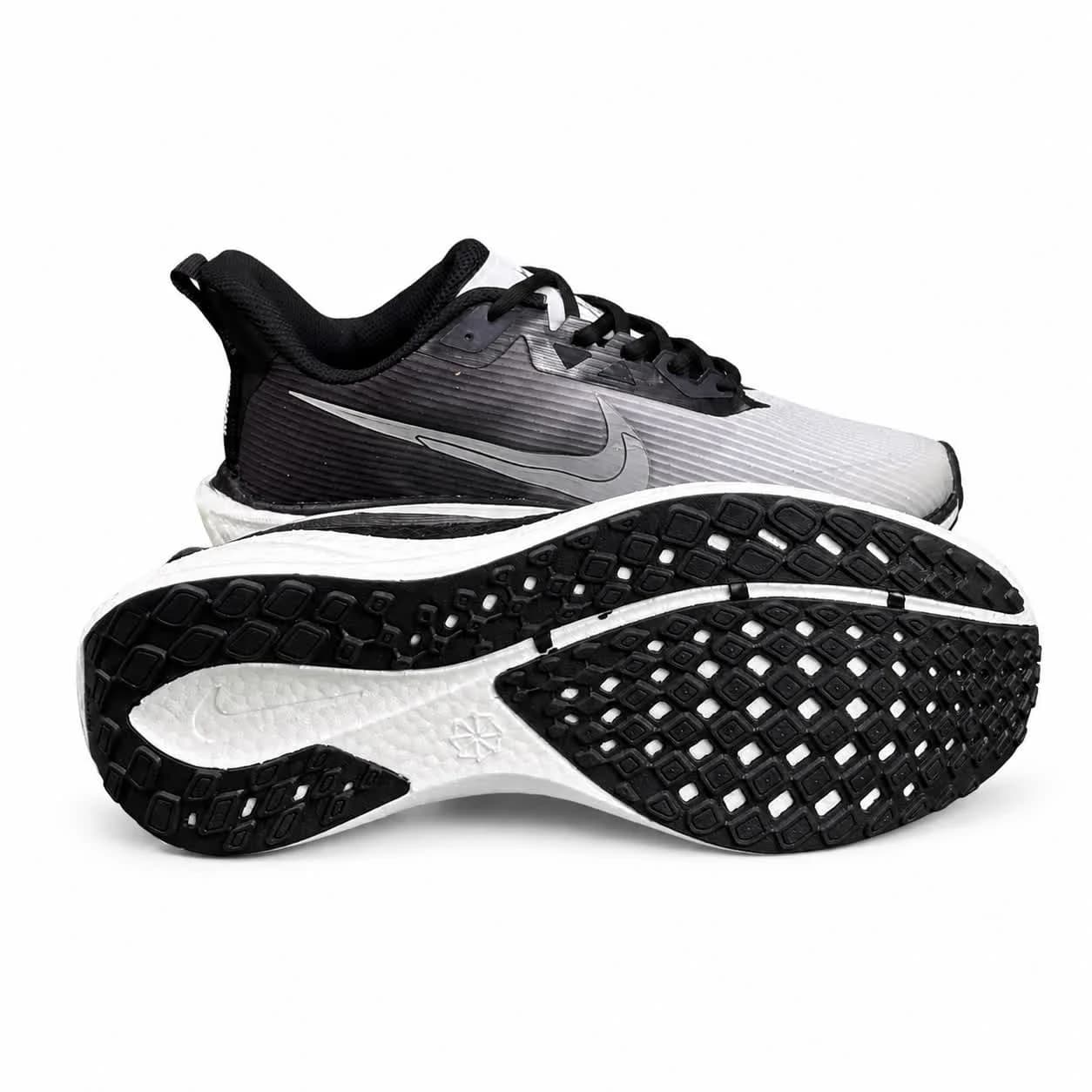 کتونی زیره بست مردانه مدل رانینگ نایکی طوسی و سفید NIKE — تصویر ۴