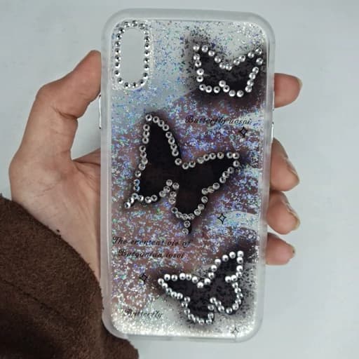 گارد Iphone x طرح شفاف نگین دار و شاین دار پروانه ای رنگ مشکی دور نگین آیفون ایکس قاب و کاور