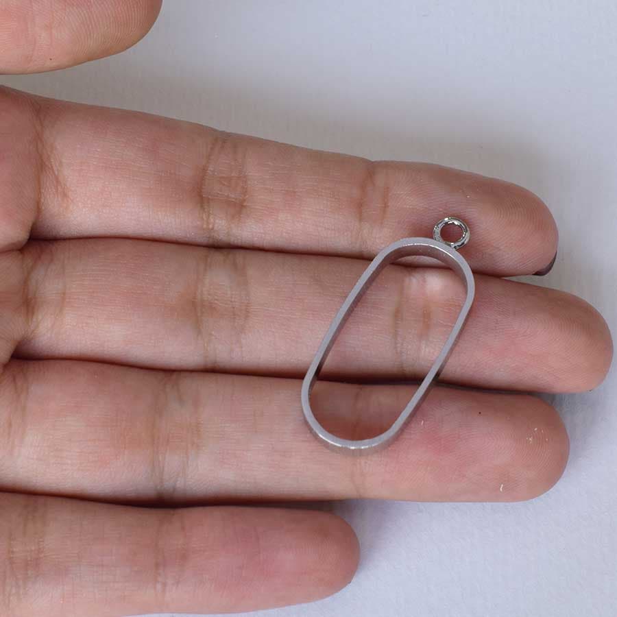 قاب آویز رزین رنگ نقره ای مدل بیضی بدون کفه 15*30 میلیمتر — تصویر ۲