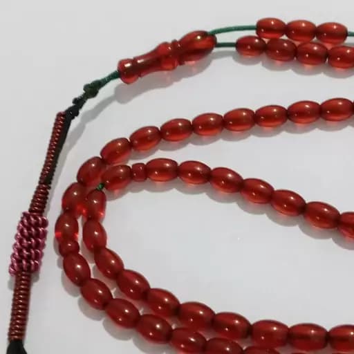 تسبیح 101دانه سندلوس رنگ زرشکی تراش گندمی | تسبیح سنگی — تصویر ۵