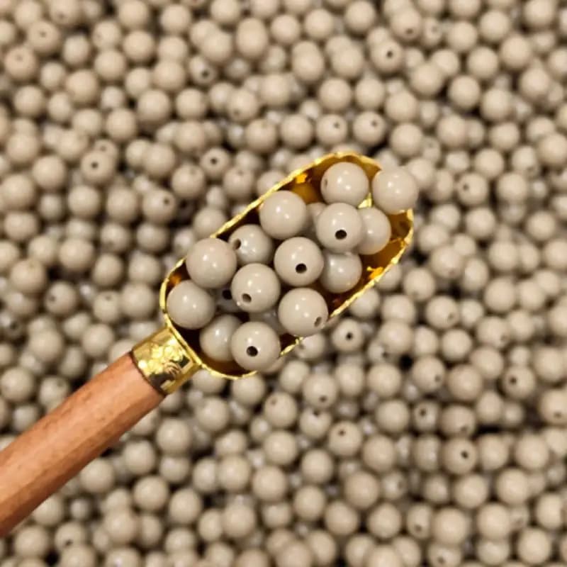 مهره رنگی ایرانی رنگ خاکی سایز10میل(100گرمی)
