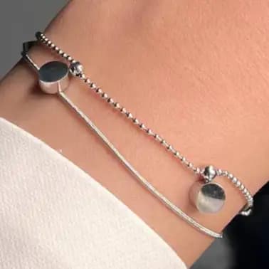 دستبند زنانه و دخترانه استیل طرح دولاین آویز استوانه ای ضد حساسیت رنگ کاملا ثابت کد atk