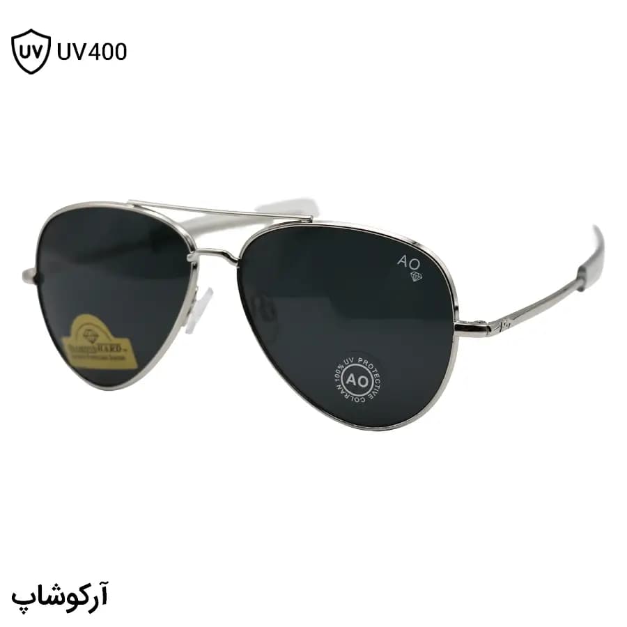عینک آفتابی American Optical با فریم خلبانی، رنگ نقره‌ای براق، عدسی جنس سنگ (شیشه) و دودی تیره مدل AO-1004