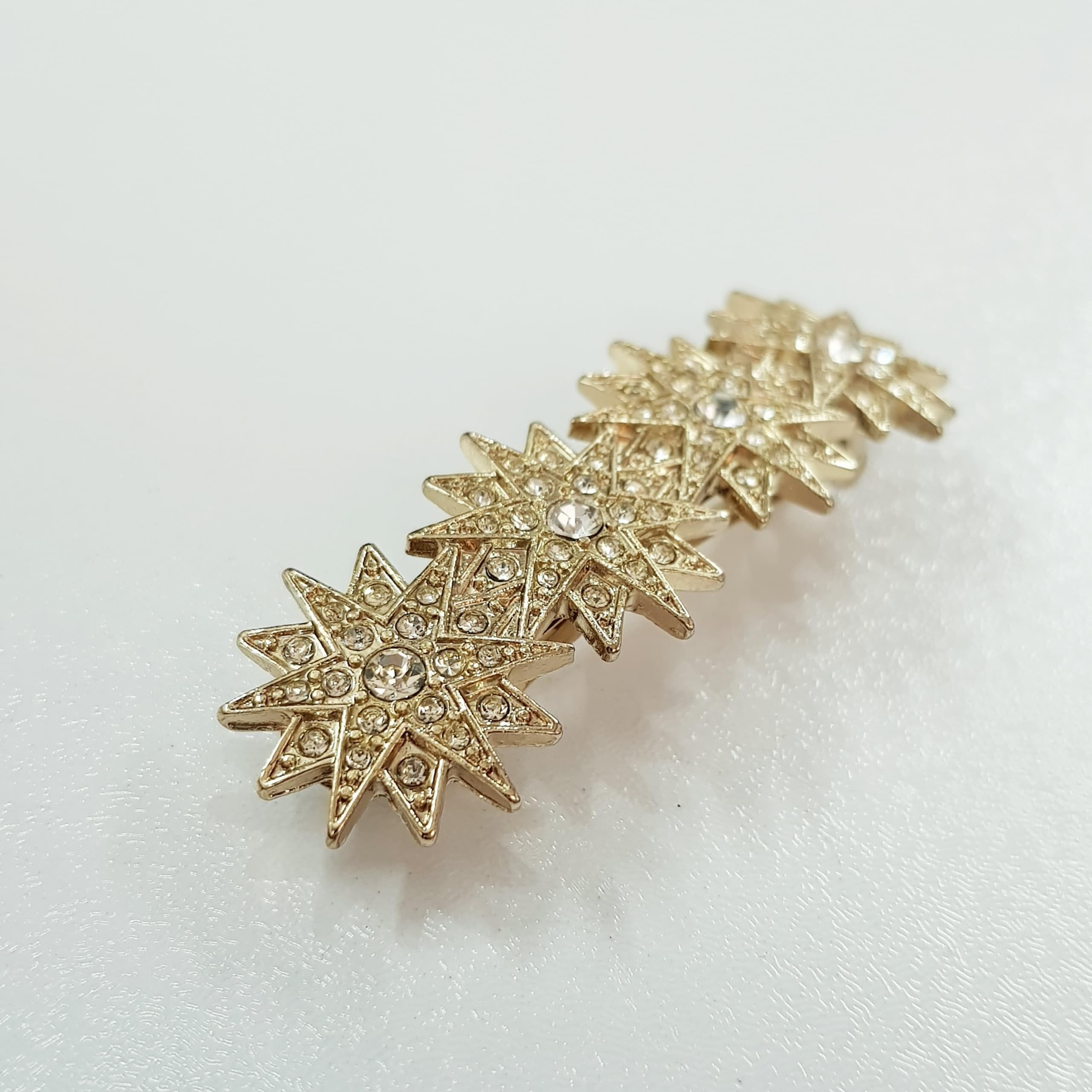 گیره مو کلیپسی طلایی مدل ستاره نگین دار برند Accessories کد ۱۷۰۹۵ — تصویر ۳