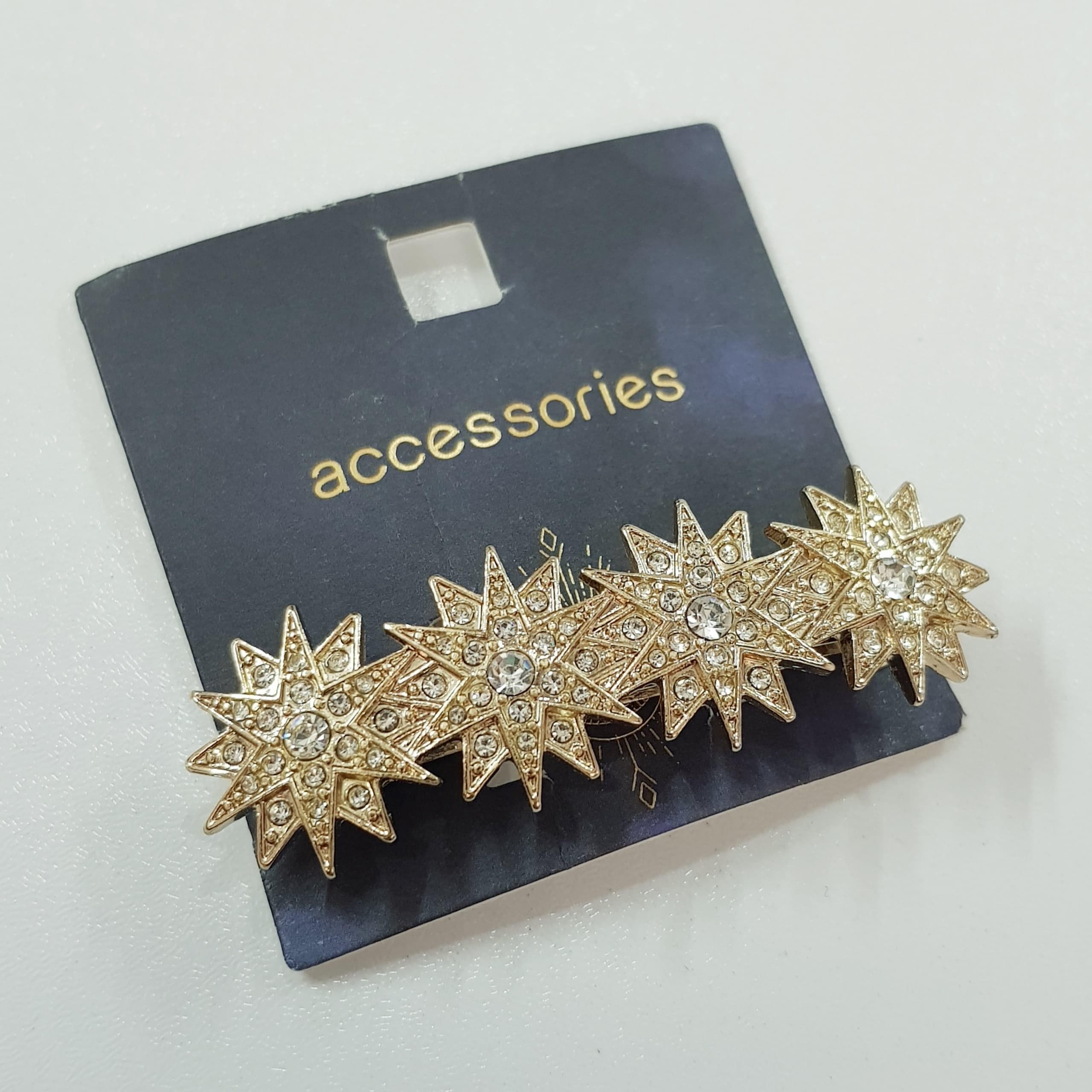 گیره مو کلیپسی طلایی مدل ستاره نگین دار برند Accessories کد ۱۷۰۹۵ — تصویر ۵
