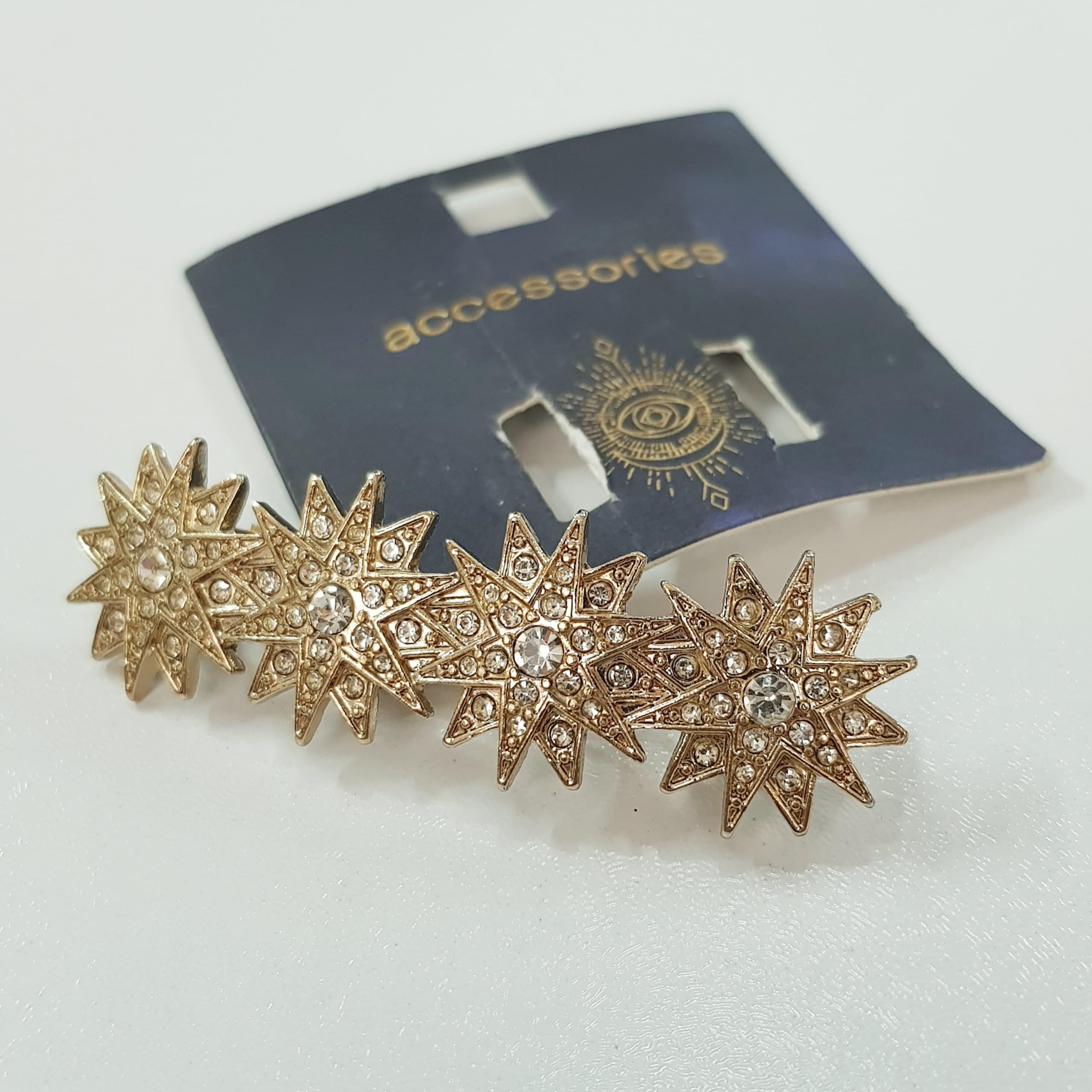 گیره مو کلیپسی طلایی مدل ستاره نگین دار برند Accessories کد ۱۷۰۹۵ — تصویر ۲