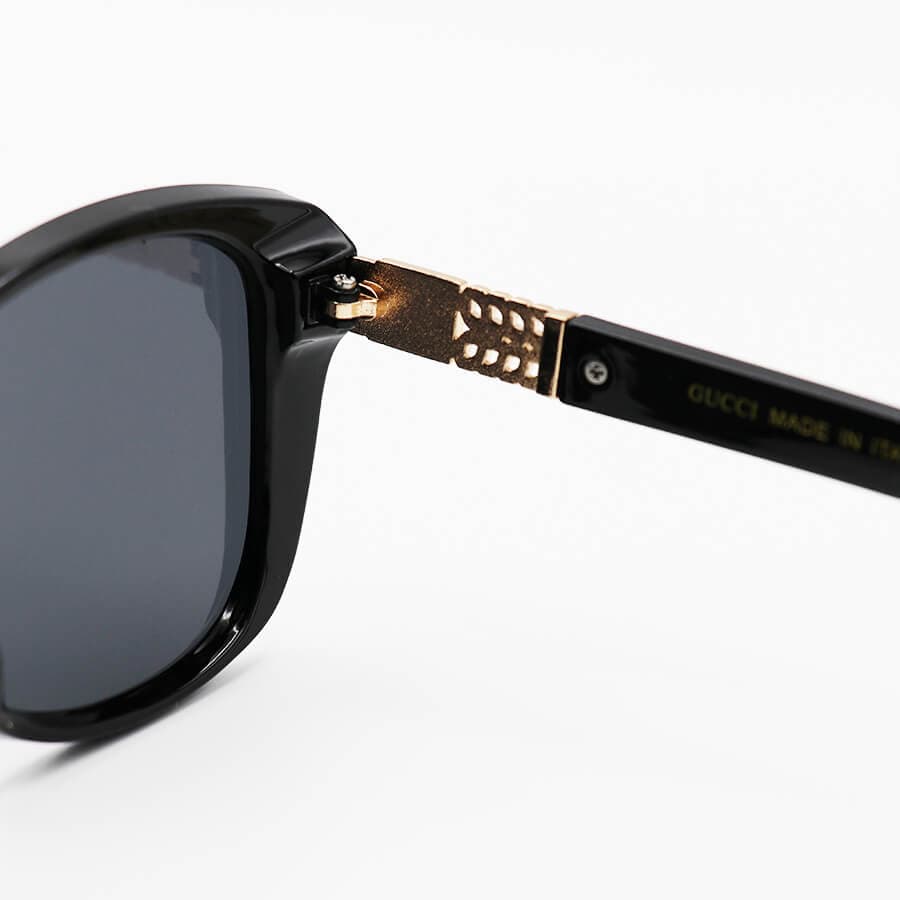 عینک آفتابی زنانه GUCCI با فریم مشکی رنگ، چشم گربه ای شکل و لنز دودی تیره مدل M9060 — تصویر ۴