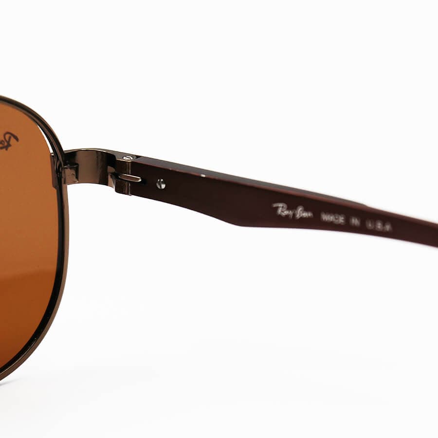 عینک آفتابی Ray-Ban با فریم خلبانی، رنگ مسی و لنز قهوه ای تیره و پلاریزه مدل P2029 — تصویر ۴