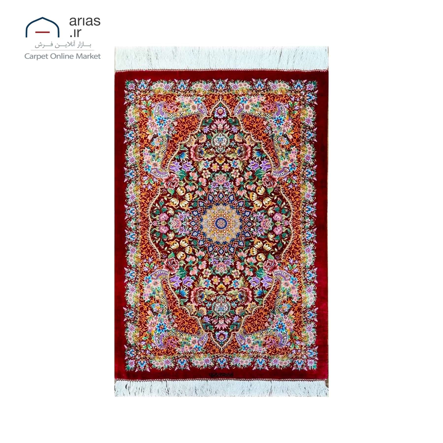 فرش دستباف تمام ابریشم 60 در 90 زمینه زرشکی مارک نورمحمدی بافت قم کد D03302G