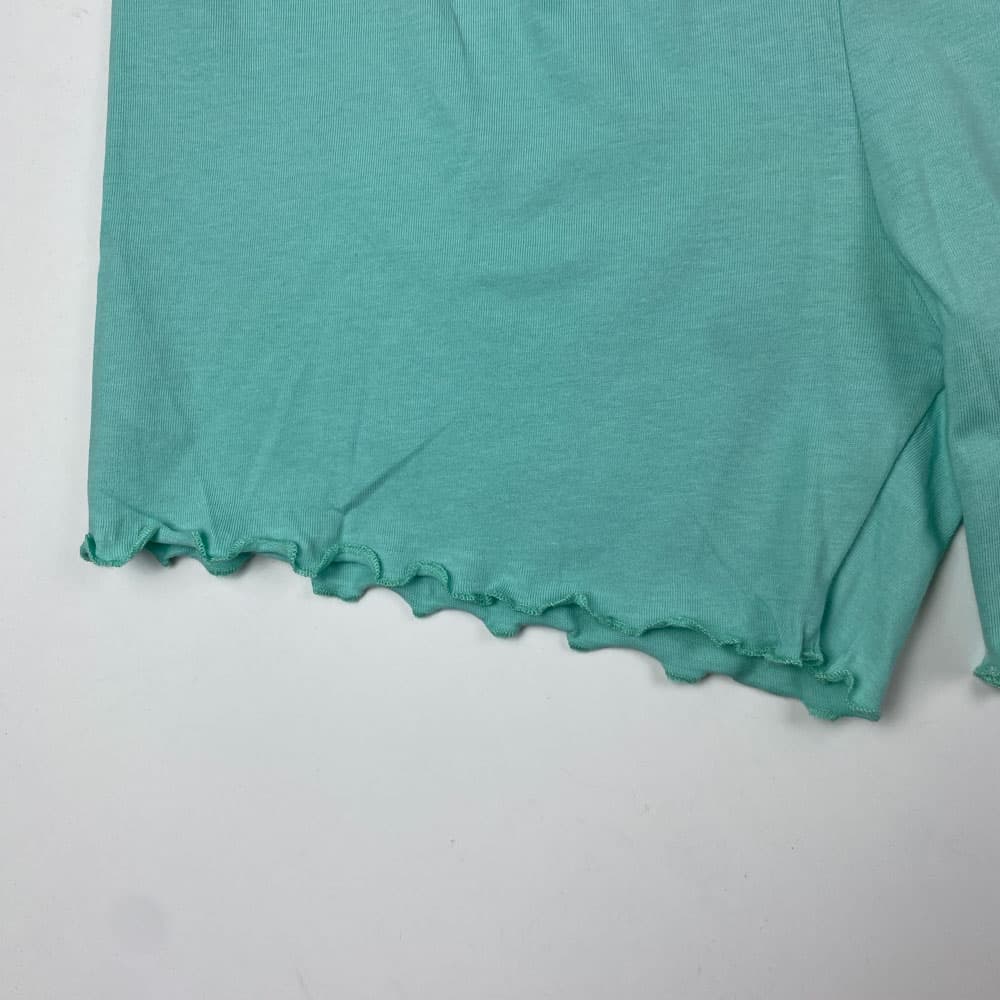 شلوارک دخترانه طرح دالبری کمرکش سبز صابونی رنگ – 11 تا 12 سال — تصویر ۲