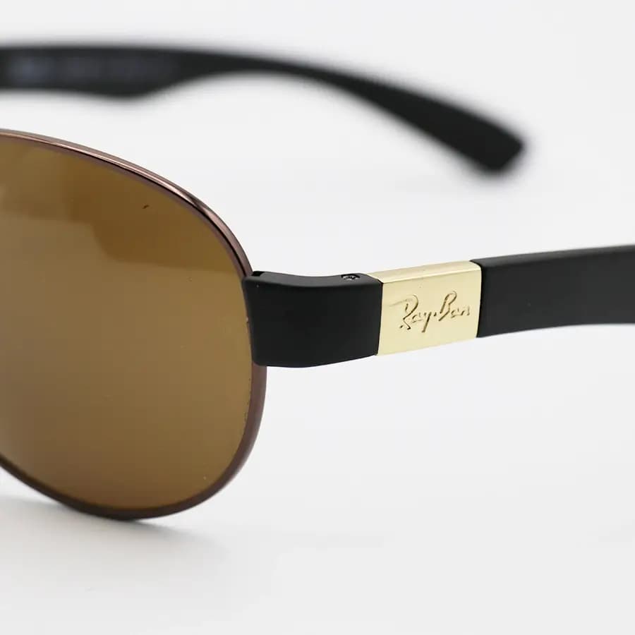 عینک آفتابی Ray-Ban با فریم شکل خلبانی، رنگ مسی، عدسی شیشهای و قهوهای تیره مدل RB3509 — تصویر ۵