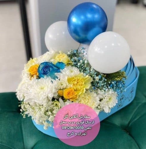 دسته گل و کیک برای تبریک نوزاد تازه‌متولد با گل آفتابگردان