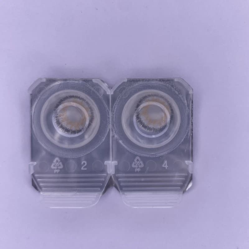 لنز رنگی چشم نیو ویژن پرو رنگ طوسی عسلی روشن بدون دور (NEW VISION-PRO) مدل آمبرگری3 (Amber Gray3) (بسته 12 عددی)