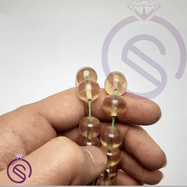 تسبیح سندلوس 33 دانه عسلی شفاف کد 22502 — تصویر ۴