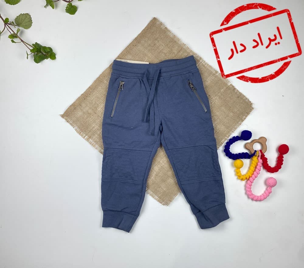ایراد دار شلوار خانگی نوزادی برند lupilu طرح جیب دار آبی نفتی رنگ