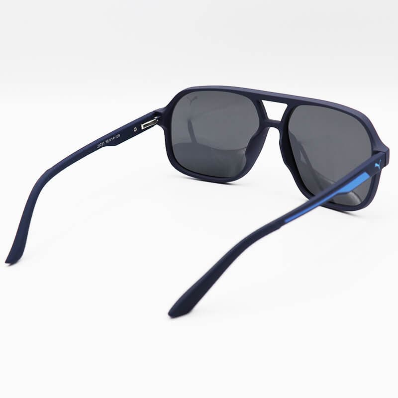 عینک آفتابی PUMA با فریم خلبانی، رنگ قهوه ای مات، لنز تیره و پلاریزه و دسته فنری مدل J1221 — تصویر ۱۱