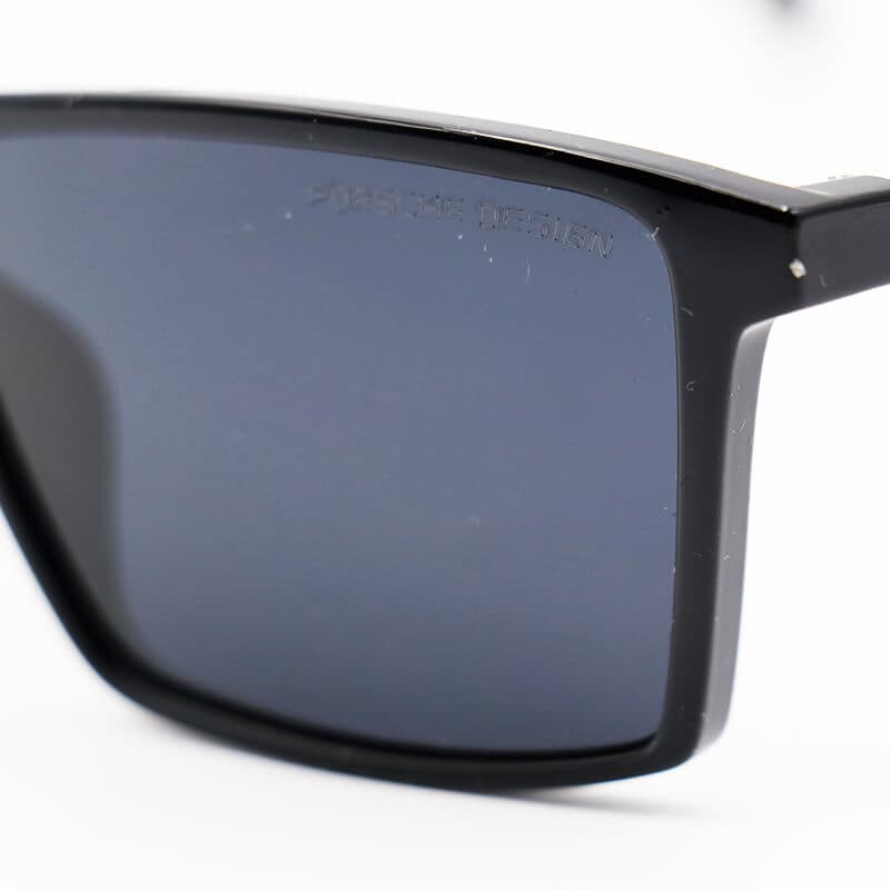 عینک آفتابی مستطیلی با فریم مشکی براق، لنز پلاریزه و دودی تیره Porsche Design مدل JB5529 — تصویر ۵