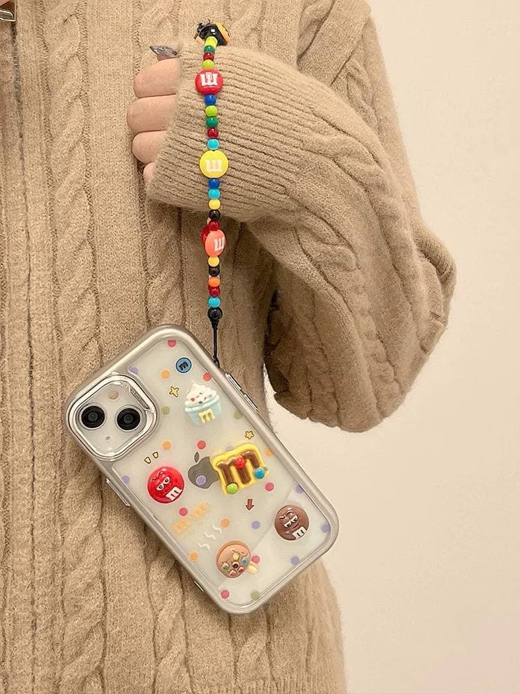 قاب آیفون m&m همراه با آویز — تصویر ۲