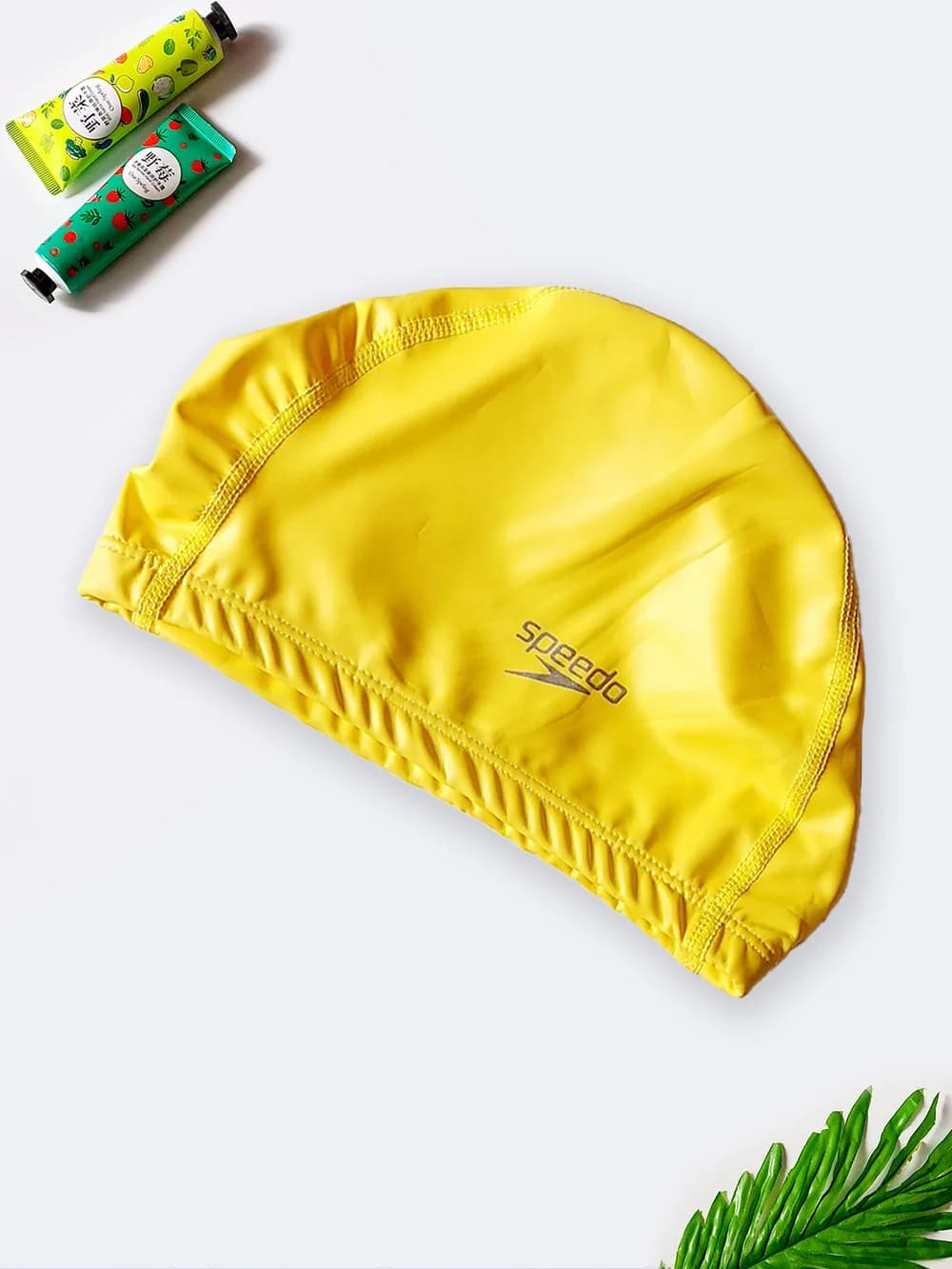 کلاه استخر شنا با جنس فومی طرح ساده مارک اسپیدو ( Speedo ) زرد رنگ
