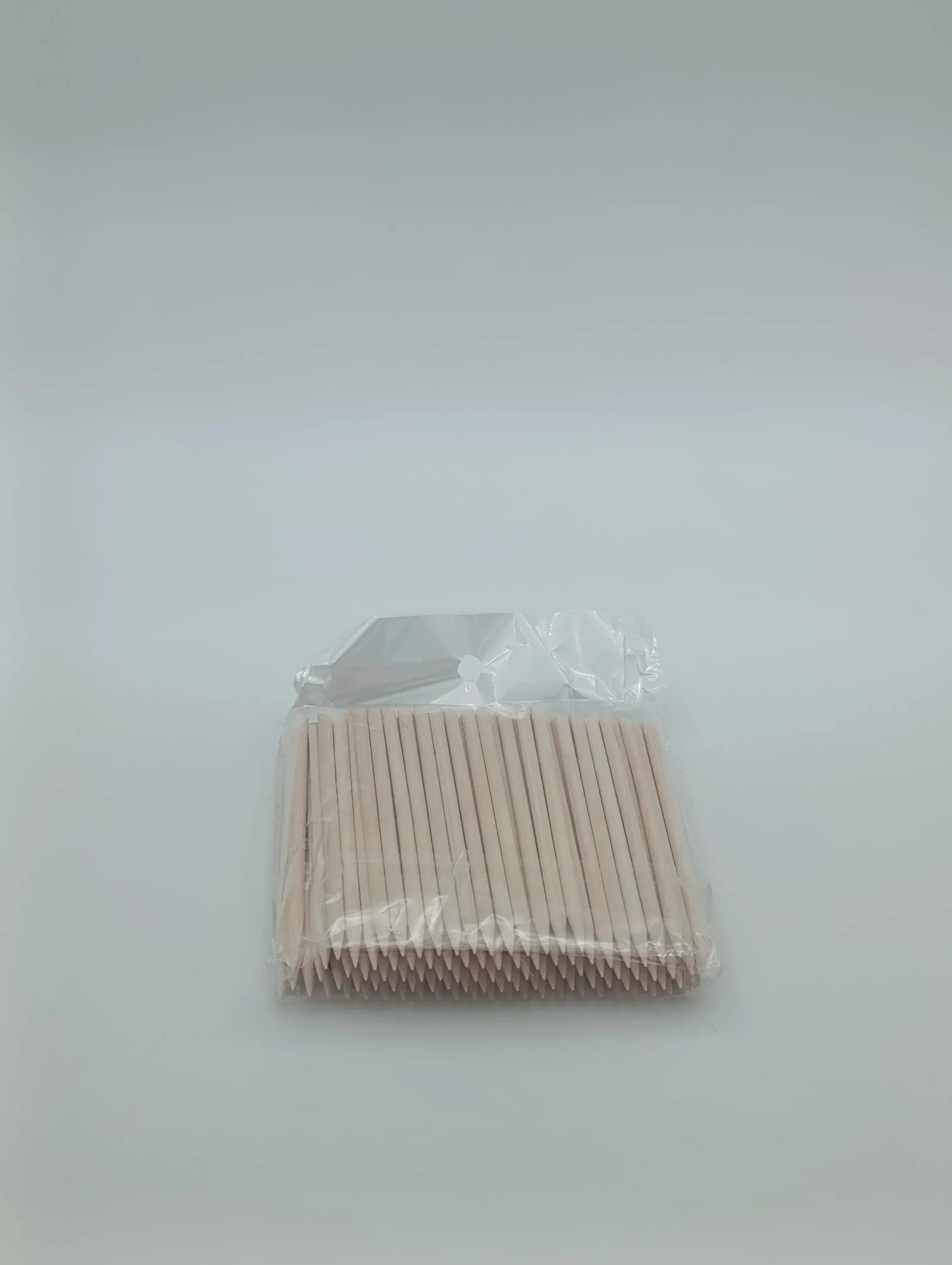 عقب‌زن چوبی مانیکور ناخن بسته ۱۰۰ عددی (چوب نارنج دو طرفه یکبار مصرف)