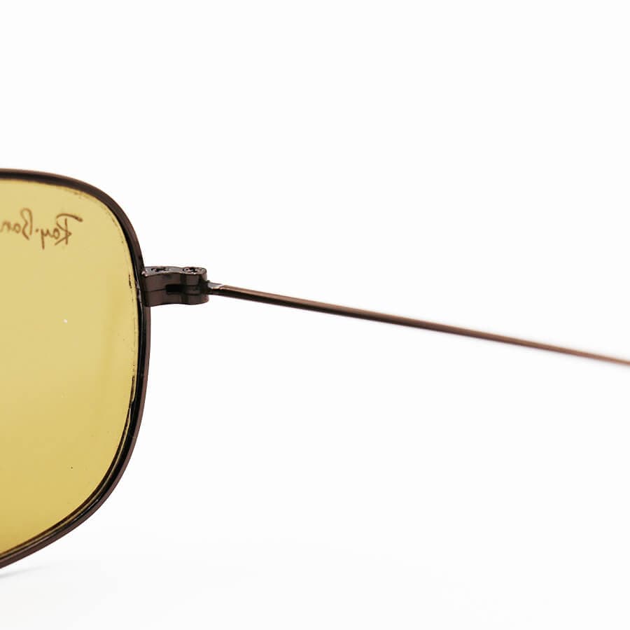 عینک آفتابی Ray-Ban با فریم مستطیلی شکل، رنگ مسی و لنز قهوه ای تیره مدل RB3145 — تصویر ۴