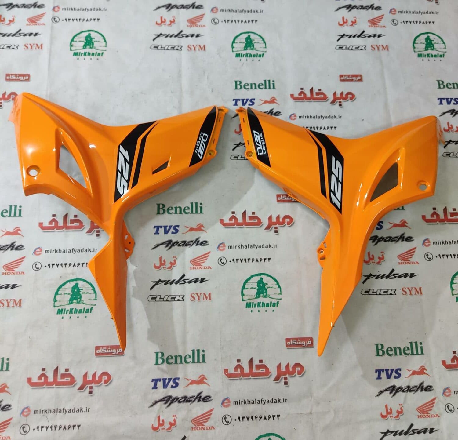 قاب (کاور فلاپ) بغل انجین پایین موتور tvs راکس جدید انژکتوری نارنجی اصلی (سمت چپ)